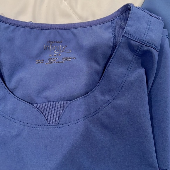 Pair of ceil blue scrubs, medium top and large bottom. See pictures for flaws. - Picture 7 of 11